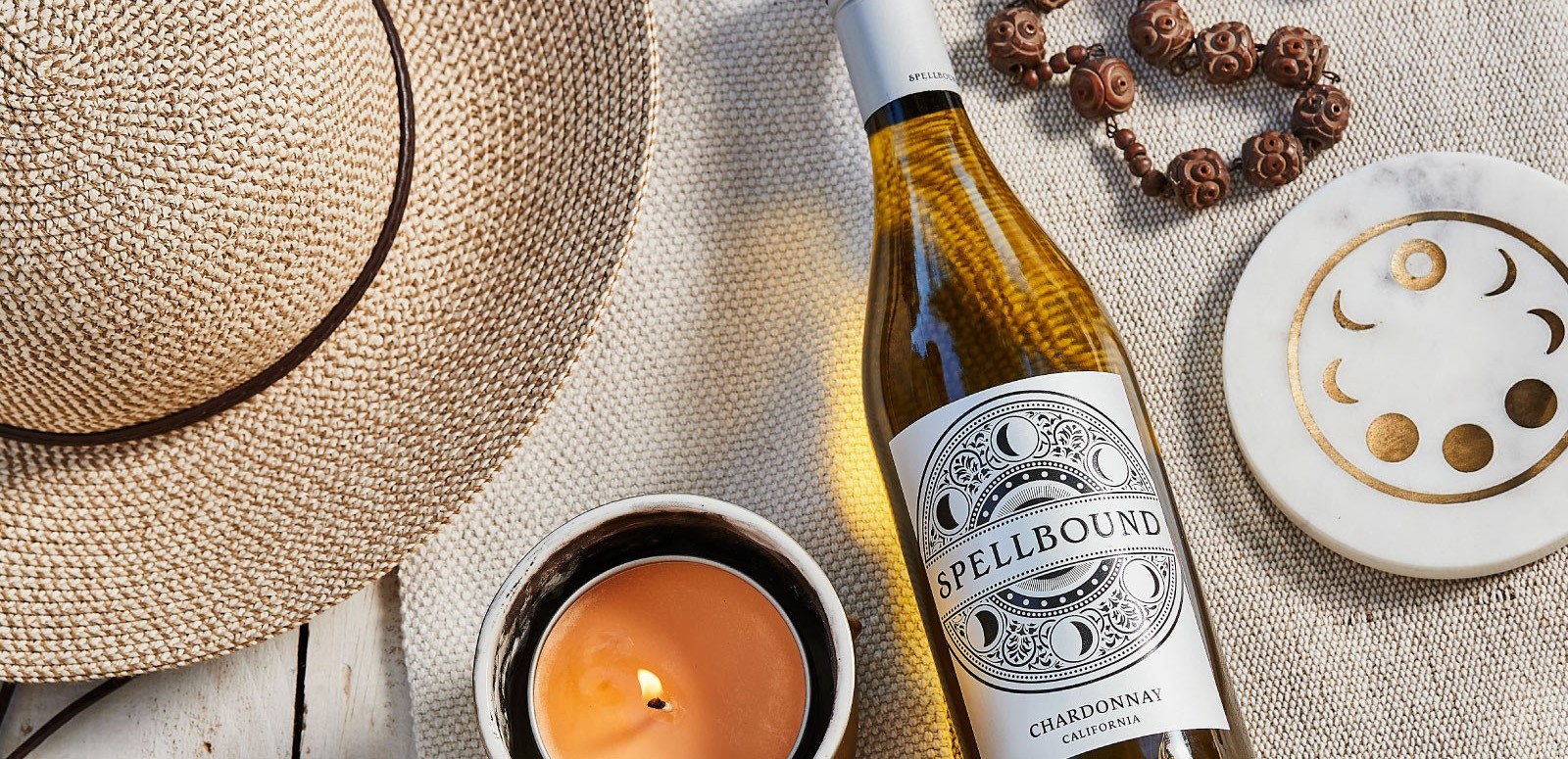 Spellbound chardonnay on table with candle